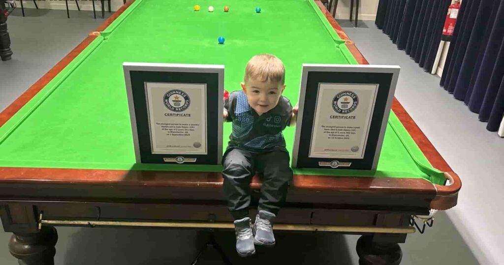 Two-year-old Jude Owens celebrates after setting two Guinness World Records with snooker trick shots in 2026