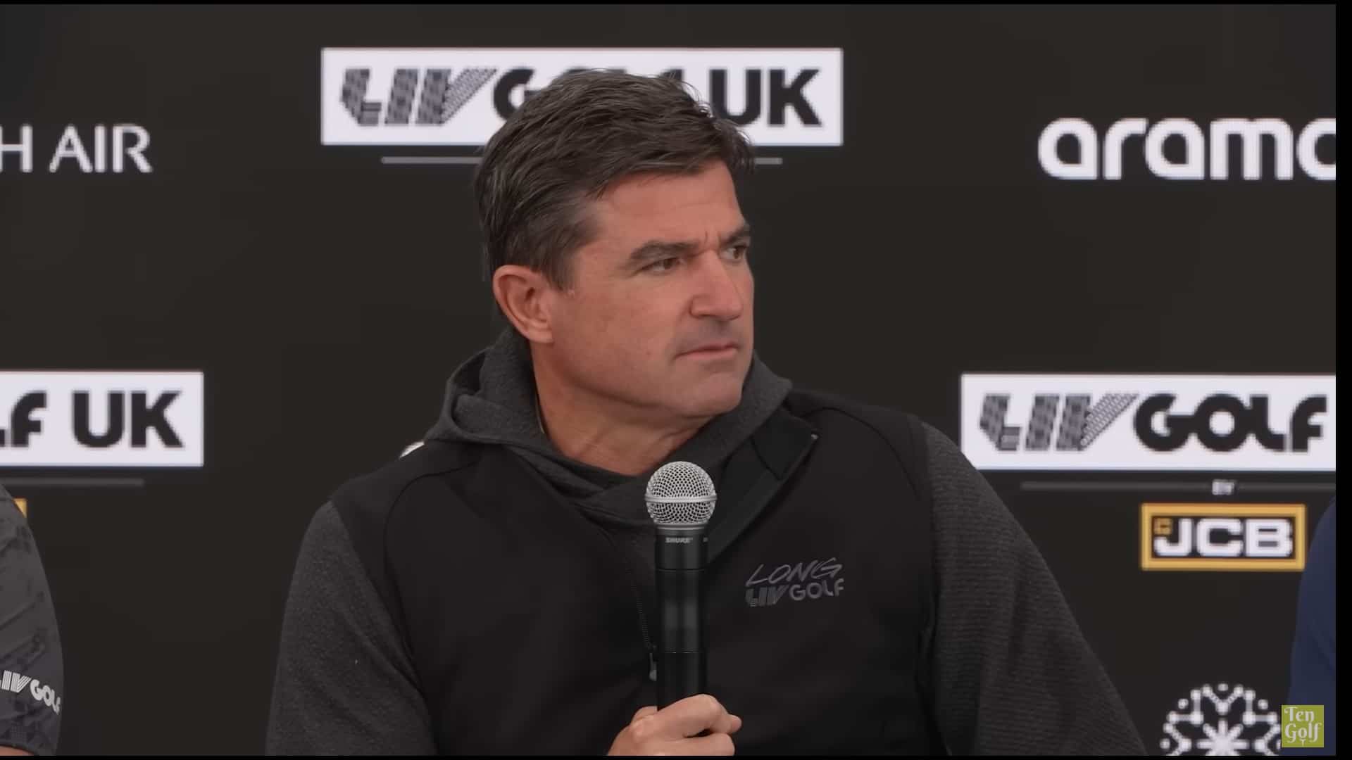 Scott O’Neil, CEO of LIV Golf, speaking at a golf event